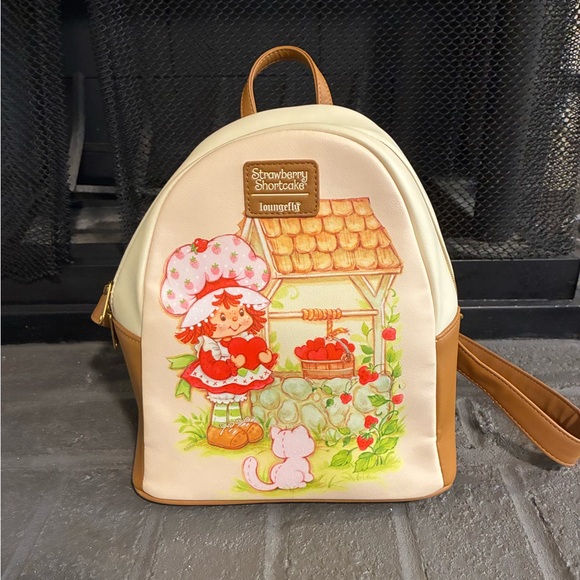 Loungefly Handbags - Strawberry Shortcake x Loungefly Cream & Tan Mini Backpack EU